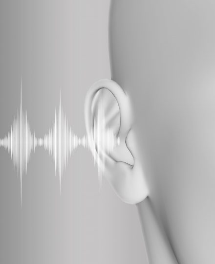 3D render of a medical background with close up of ear and soundwaves